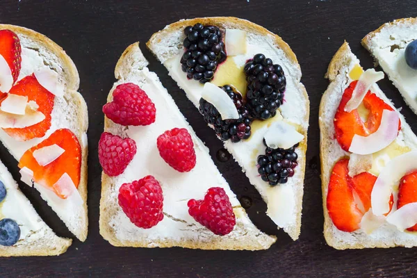 Breakfast toasts on black — Stock Photo, Image