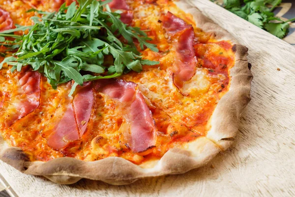 pizza with meat and herbs