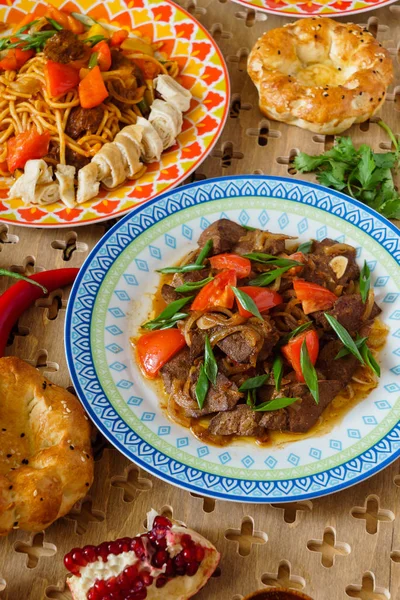 Asian food on coloured plates — Stock Photo, Image
