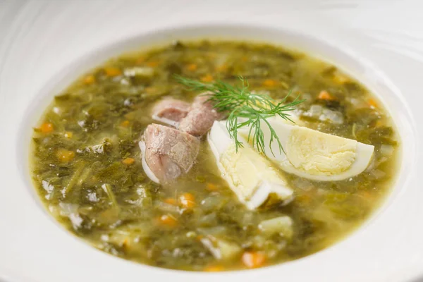 Soup with egg and meat — Stock Photo, Image