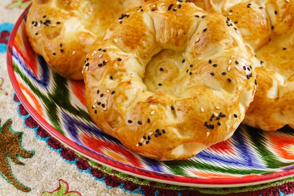 Uzbek bread on the wooden board — Stock Photo, Image