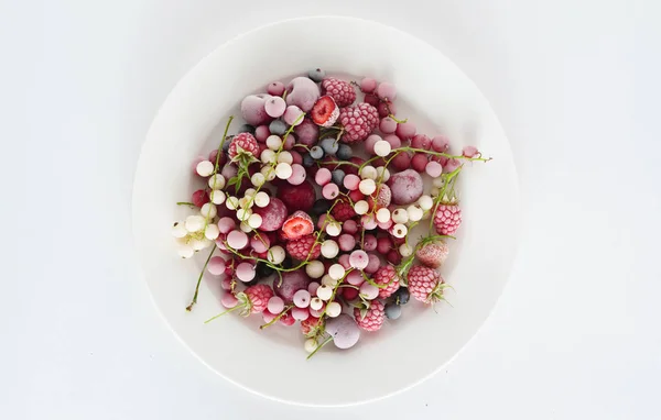 Frozen berries on plate — Stock Photo, Image