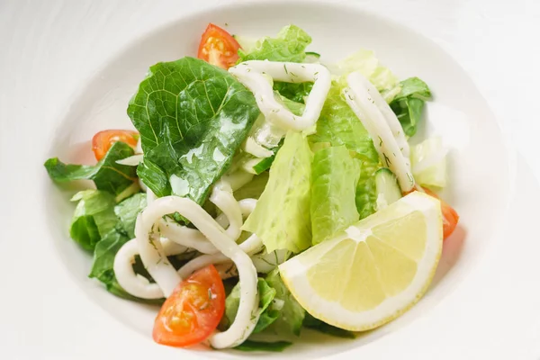 Salad with calamari on plate — Stock Photo, Image