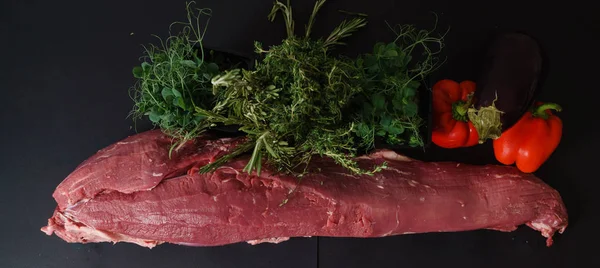 Meat on slate  slab — Stock Photo, Image
