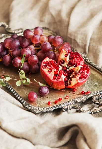 Fruits. Grapes and pomegranate — Stock Photo, Image