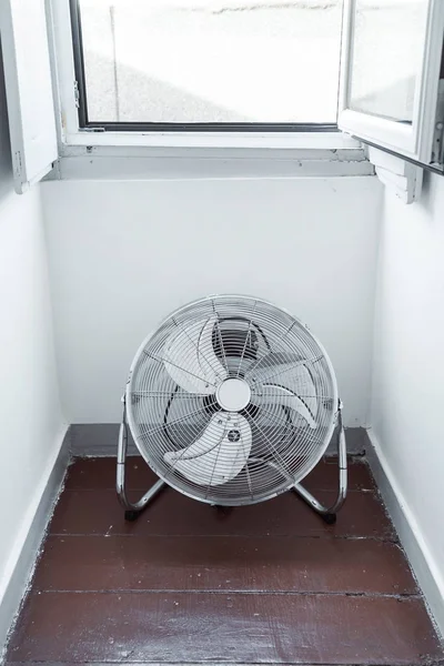 electric fan  near window, close up