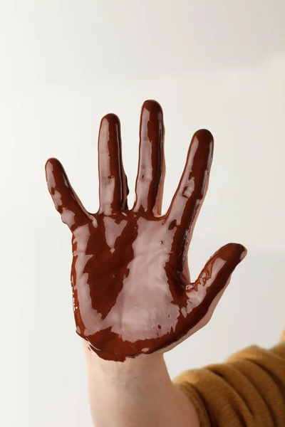 Menselijke Hand Bruine Chocolade Wit — Stockfoto