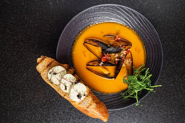 Seafood soup with toast on the black background — Stock Image Seafood Soup Toast Black Background Stock Picture