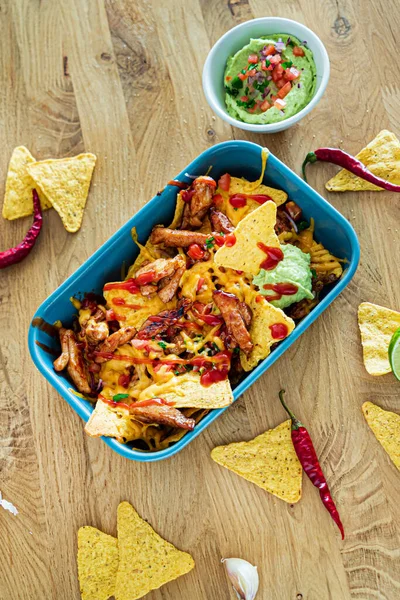 taco with avocado dip and corn chips