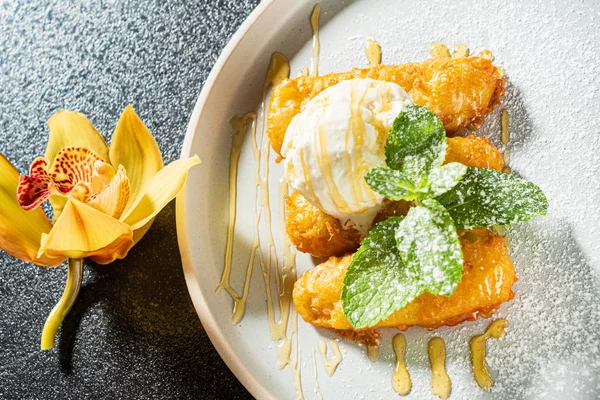 fried bananas with ice cream, close up