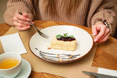 woman eating dessert in the cafe