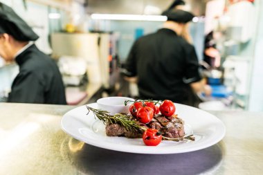 meat; steak; grill; grilled; bbq; barbeque; food; meal; butter; food, meal, plate, sauce, rosemary; cooking; picnic; stripes; veal; beef; party; chef; kitchen; restaurant