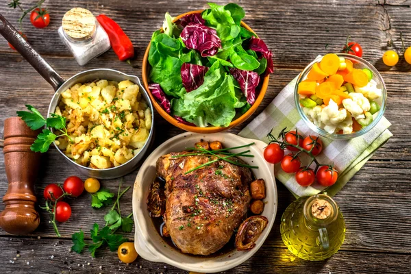 Homemade lunch of meat with potatoes and vegetables