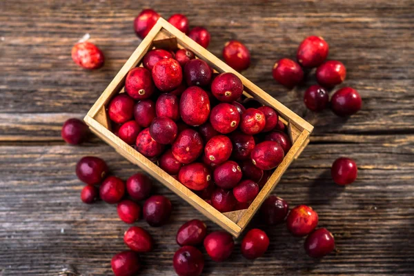 Fresh red cranberries in packing-box