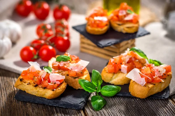 Bruschetta pieces with tomatoes — Stock Photo, Image