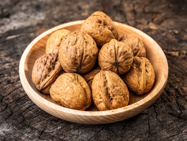 Walnuts on wooden table — Stock Photo, Image