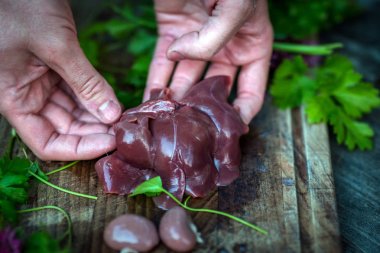 Rabbit liver in hands clipart