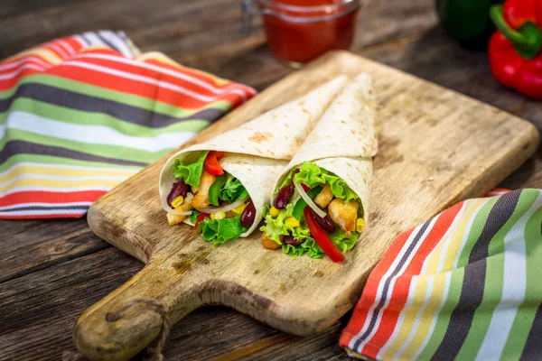 Meat and vegetables wrapped in a tortilla — Stock Photo, Image
