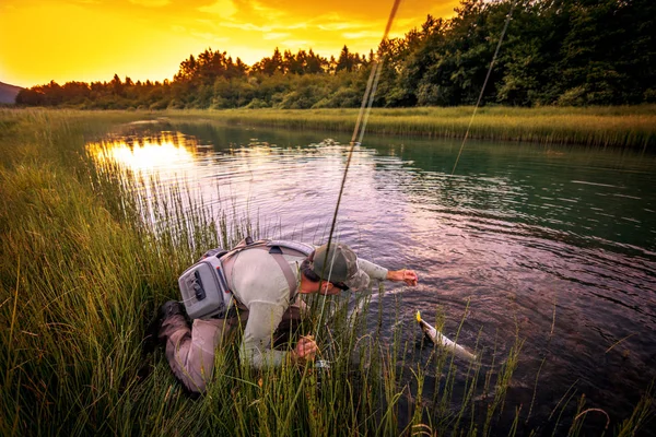 Fly fisherman fishing pike — Stock Photo, Image