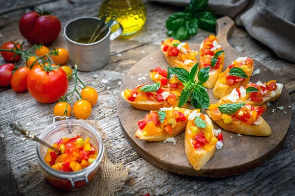 Bruschetta with tomatoes, garlic and basil — Stock Photo, Image