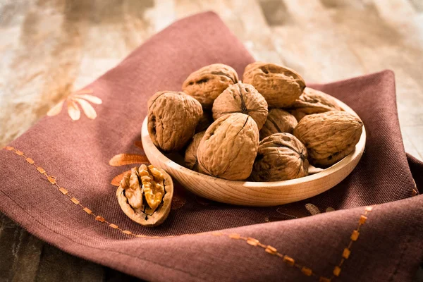 Scattered  walnuts in shell — Stock Photo, Image