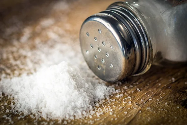 Salt on wooden background — Stock Photo, Image