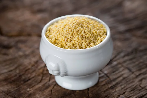 Close Millet Grains White Ceramic Dish Wooden Background — Stock Photo, Image