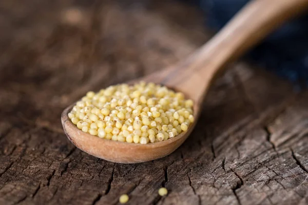 Close Millet Grains Wooden Spoon Brown Background — Stock Photo, Image