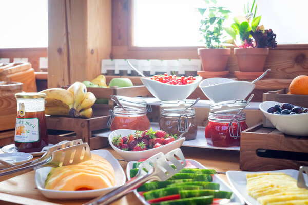 Breakfast buffet table with assorted food 