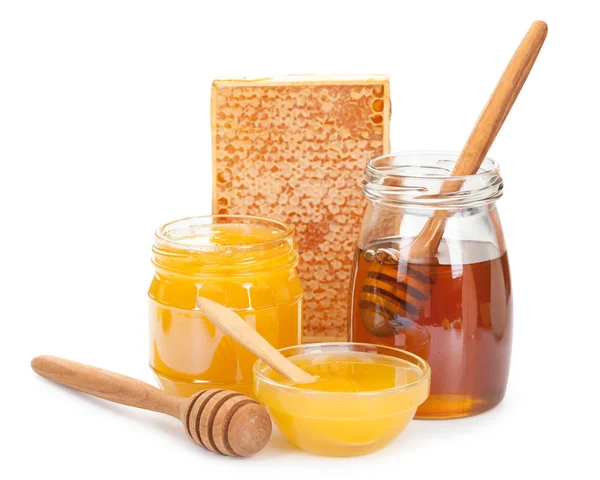 Honey in glass and wooden stick isolated on white background — Stock Photo, Image