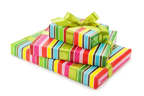 Striped boxes with gifts tied bows on white background — Stock Photo, Image