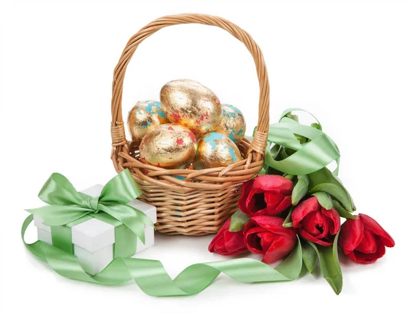 Basket with easter golden eggs on white background. — Stock Photo, Image