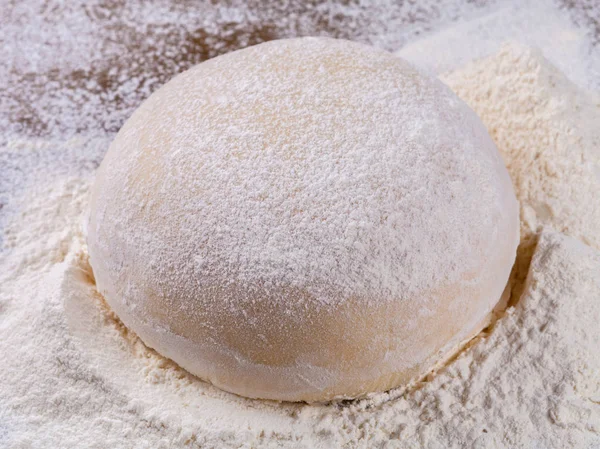 Dough on old wooden table. Easter concept. — Stock Photo, Image