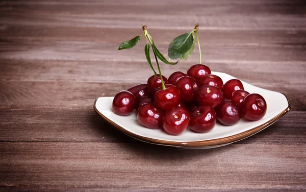 Cherry on wooden background — Stock Photo, Image