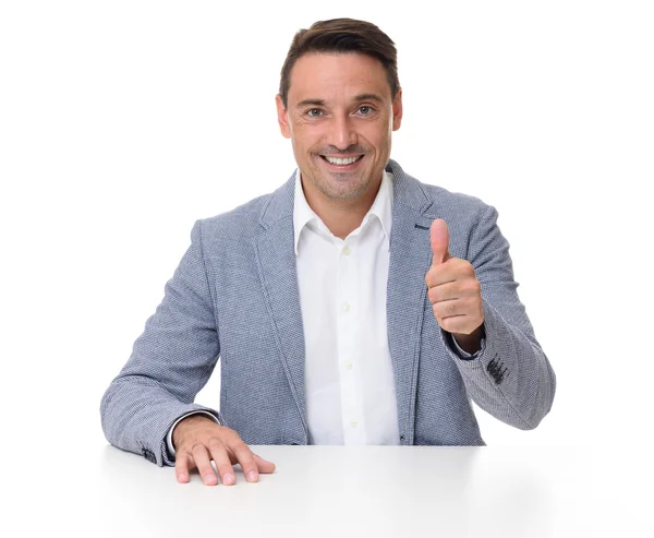 Cheerful businessman gesturing thumbs up — Stock Photo, Image