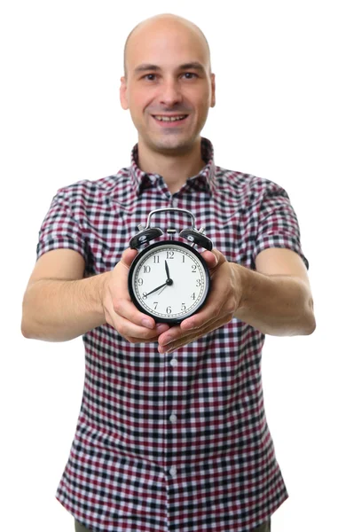 Man holds an alarm clock. Isolated — Stock Photo, Image