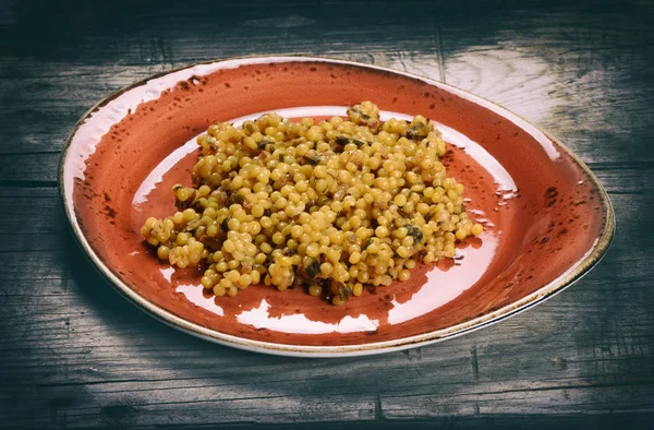 Couscous with mushrooms — Stock Photo, Image