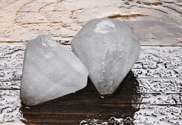 Ice cubes on a wooden background — Stock Photo, Image