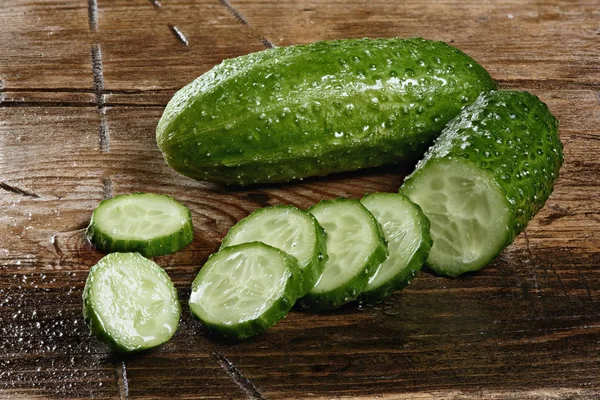 Fresh cucumber on wooden table — Stock Photo, Image