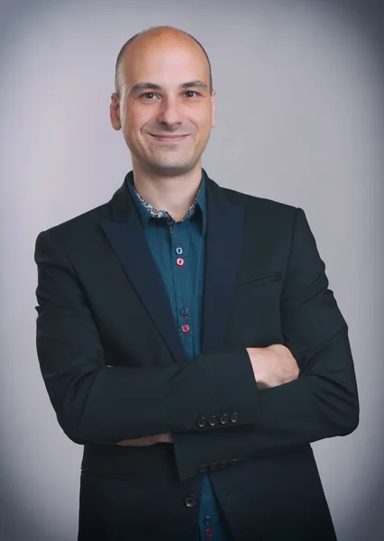 Smiling handsome businessman in suit — Stock Photo, Image