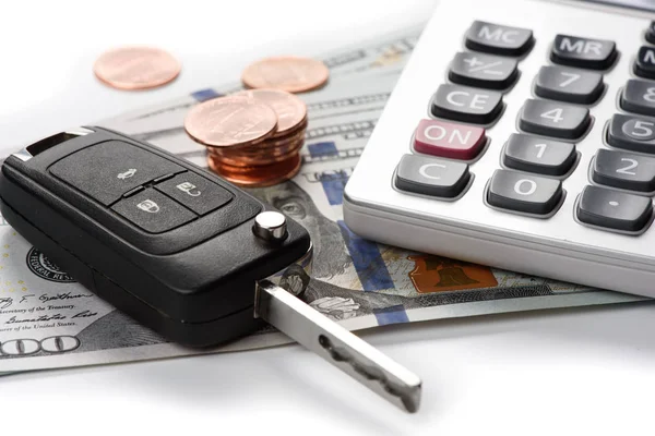 Car key with dollars and calculator — Stock Photo, Image