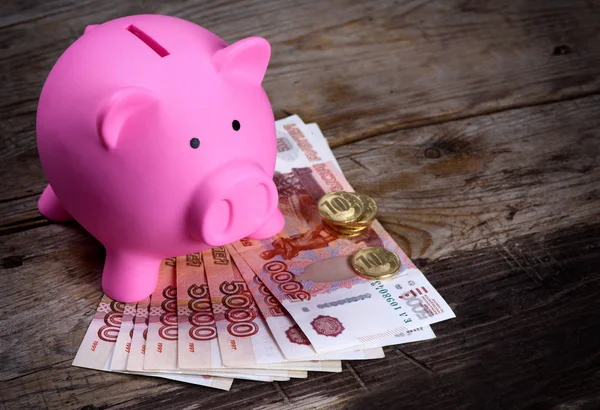 Piggy bank and Russian money. — Stock Photo, Image