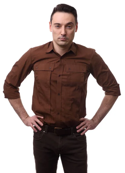 Serious man with hand on hips — Stock Photo, Image