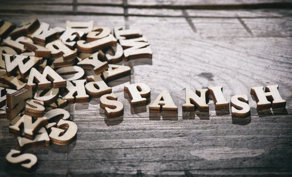 Palavra espanhola feita com letras de madeira . — Fotografia de Stock
