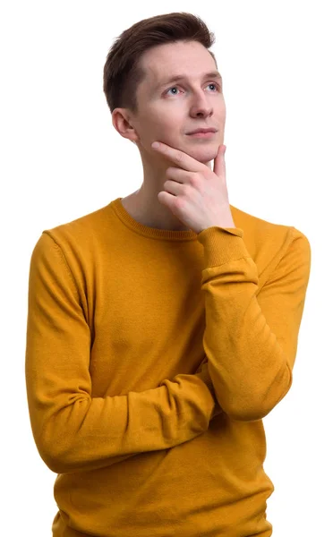 Casual young man thinking and looking up — Stock Photo, Image