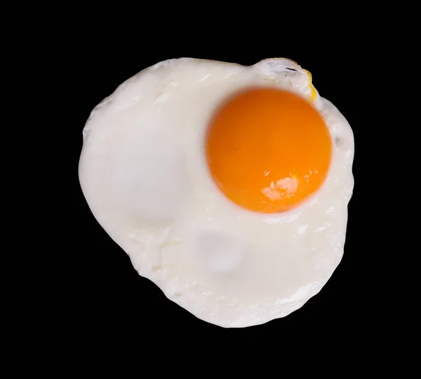 Fried egg on black — Stock Photo, Image