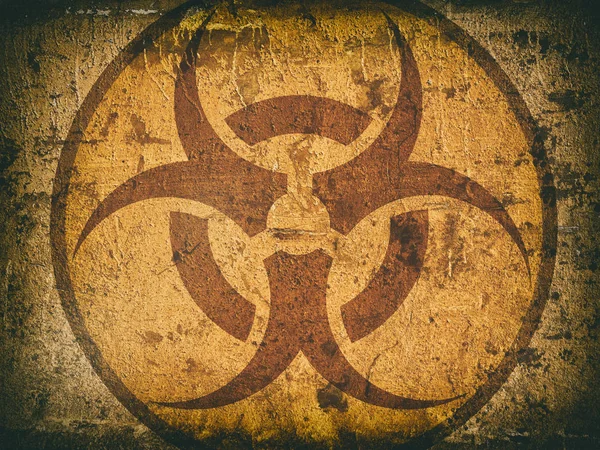 bio hazard symbol on a cracked stone wall