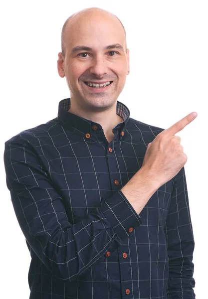 Handsome bald man pointing away — Stock Photo, Image