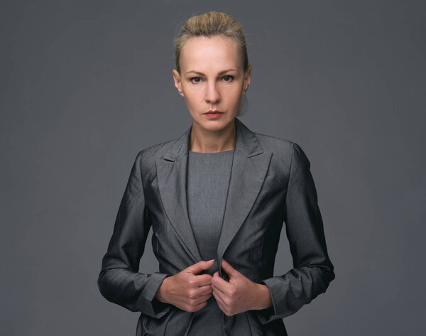 mid age Business woman in a suit, isolated