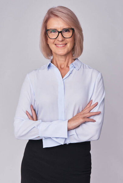 middle aged smiling business woman isolated